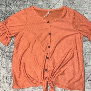 Cute blouse, material is soft. Ties at the bottom (Fake buttons)